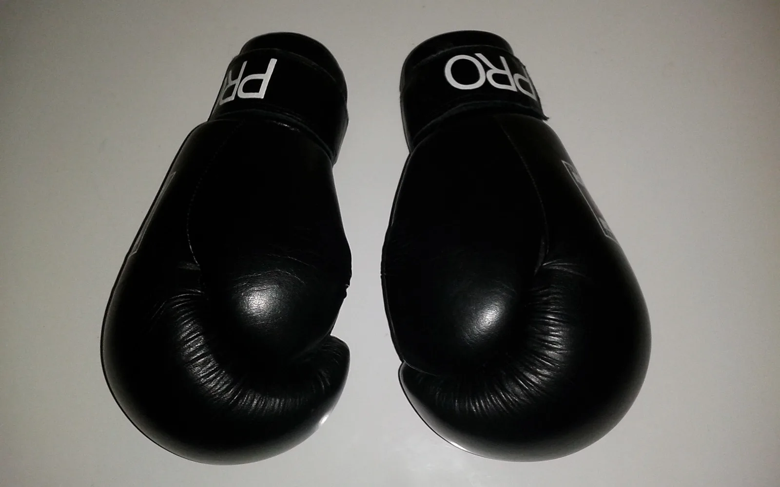Red and blue boxing gloves on a white background